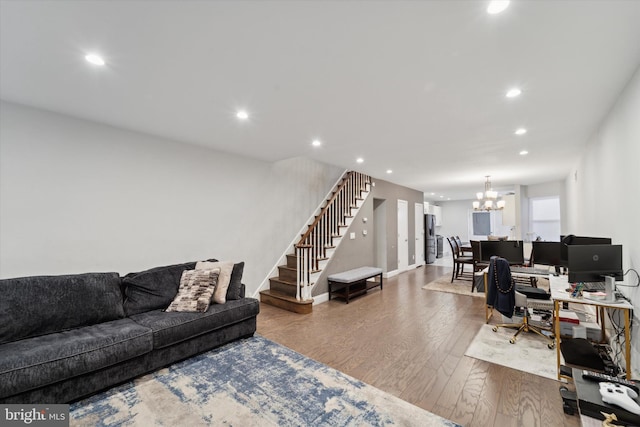 interior space featuring wood-type flooring and a notable chandelier