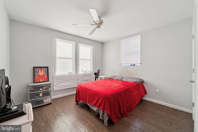 bedroom with ceiling fan and dark hardwood / wood-style flooring