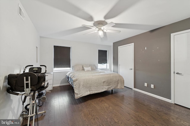 bedroom featuring ceiling fan and dark hardwood / wood-style flooring