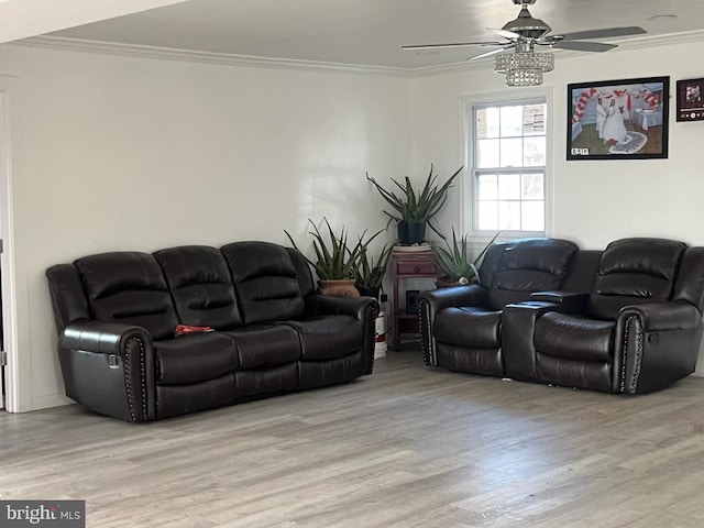 living room featuring ceiling fan, light hardwood / wood-style flooring, and ornamental molding