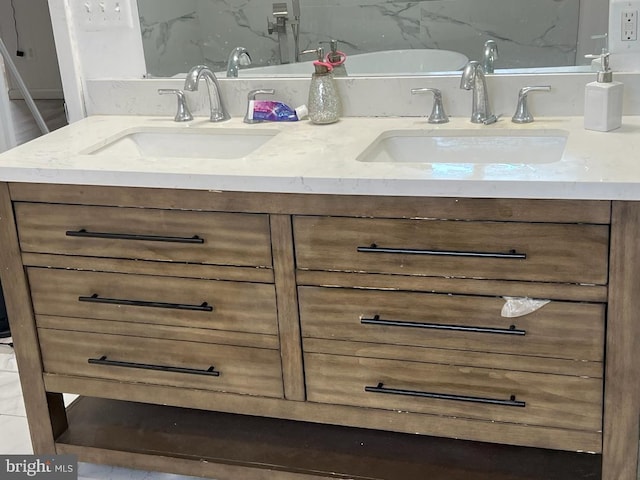 bathroom with vanity and tasteful backsplash