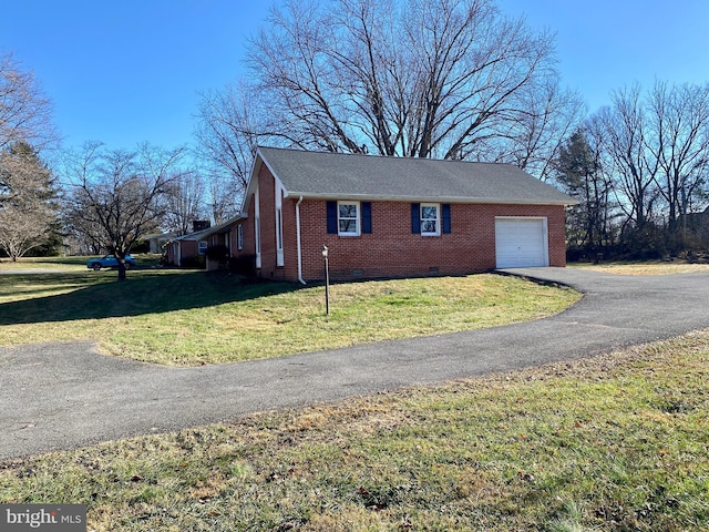 view of property exterior with a garage and a lawn