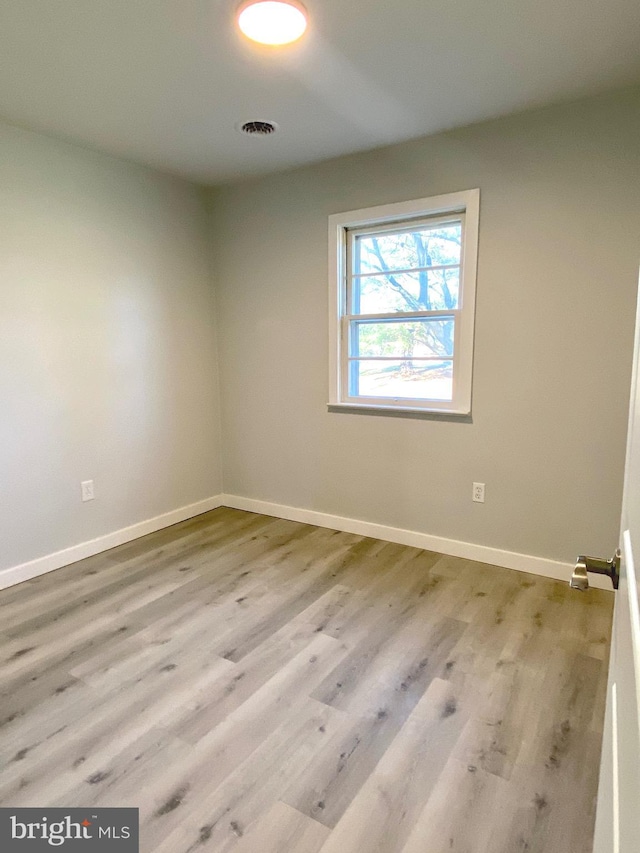 empty room with light wood-type flooring