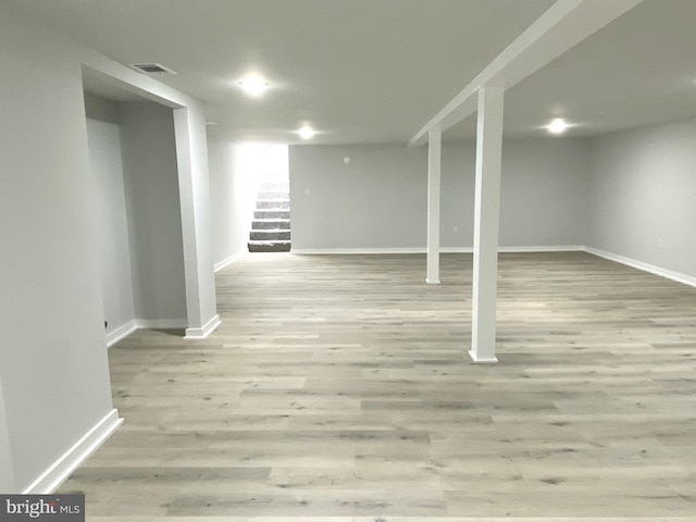 basement featuring light wood-type flooring