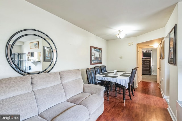 dining space featuring dark hardwood / wood-style floors