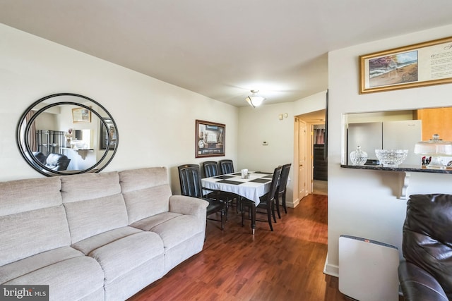 living room featuring dark hardwood / wood-style floors