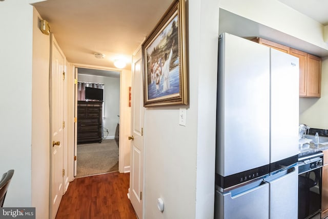 hall with dark hardwood / wood-style flooring