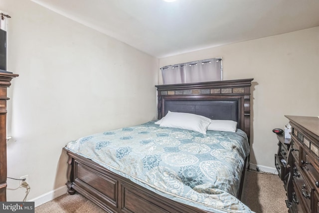 bedroom with light colored carpet