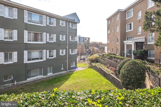 view of property's community with a lawn