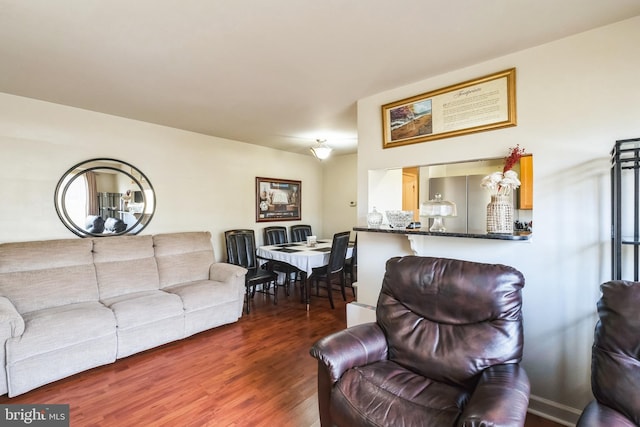 living room with dark hardwood / wood-style flooring