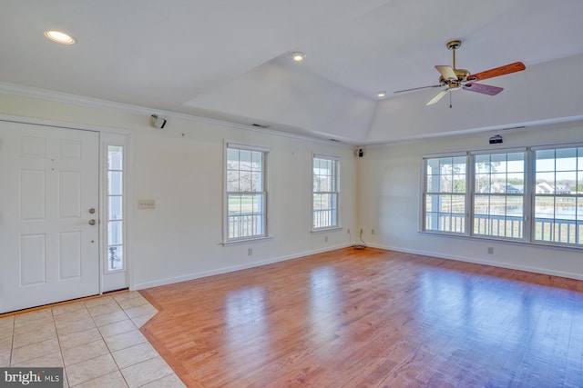 entrance foyer featuring lofted ceiling, light hardwood / wood-style flooring, ceiling fan, and crown molding