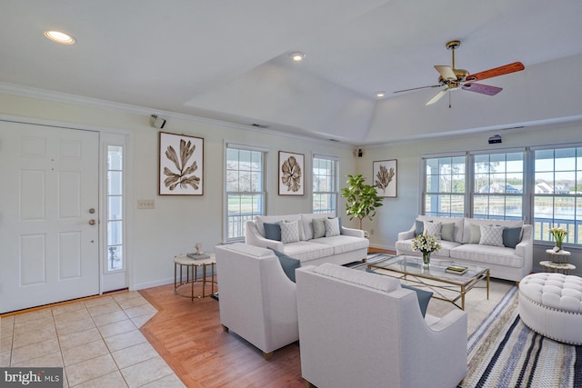 living room with crown molding, ceiling fan, a healthy amount of sunlight, and light hardwood / wood-style floors