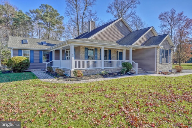 single story home with covered porch and a front lawn