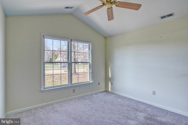 empty room with ceiling fan, light carpet, and lofted ceiling