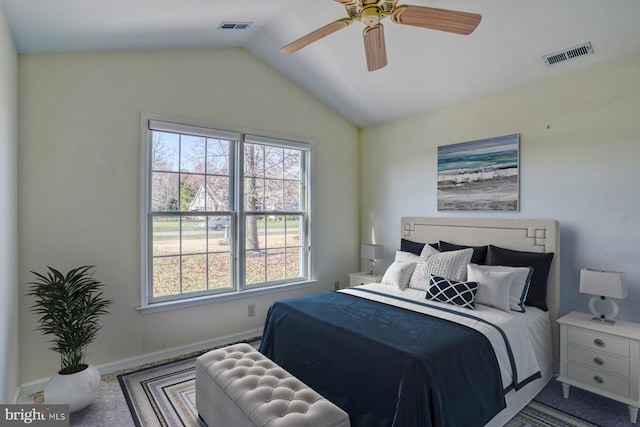 carpeted bedroom with vaulted ceiling and ceiling fan