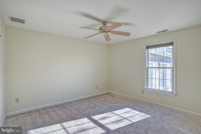 unfurnished room with light carpet and ceiling fan