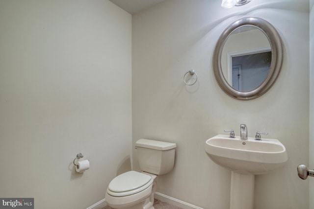 bathroom with sink and toilet