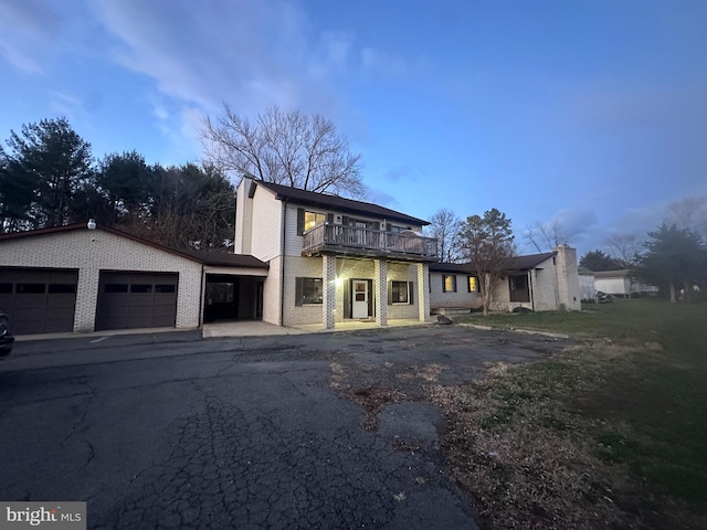 view of front of home with a balcony