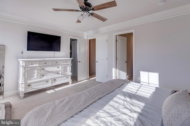 bedroom with light carpet, ceiling fan, and ornamental molding