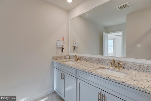 bathroom with tile patterned floors and vanity