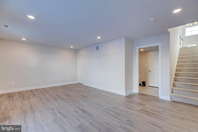 unfurnished room with light hardwood / wood-style floors