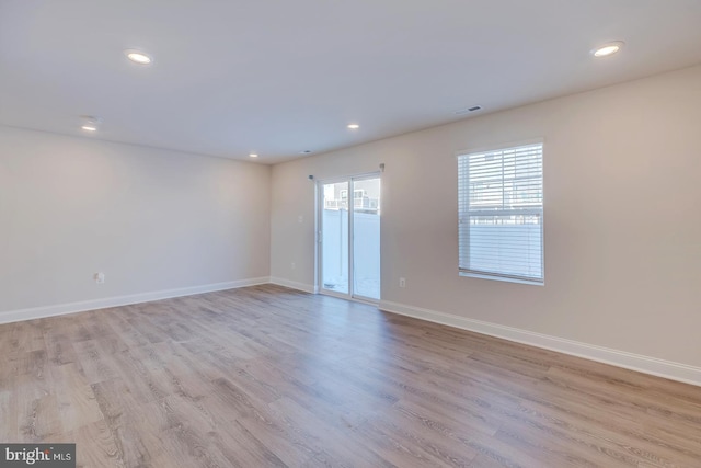 empty room with light wood-type flooring