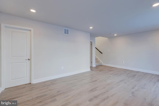 unfurnished room featuring light hardwood / wood-style floors