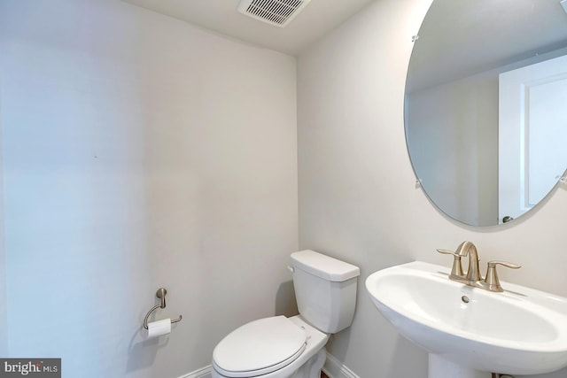 bathroom with sink and toilet