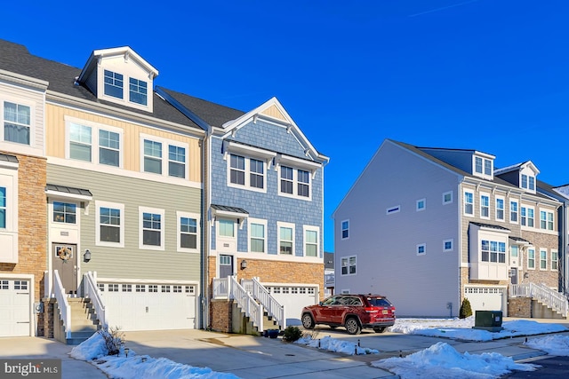 townhome / multi-family property featuring a garage