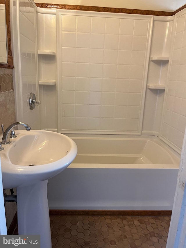 bathroom with bathing tub / shower combination