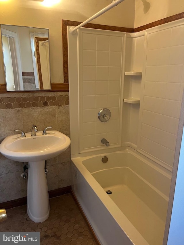 bathroom featuring bathing tub / shower combination and tile patterned flooring