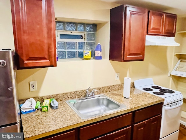 kitchen featuring sink, stainless steel fridge, and white electric stove