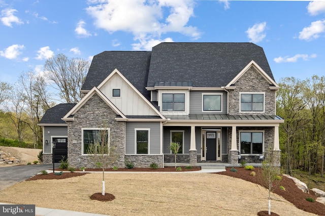 craftsman house featuring covered porch and a garage