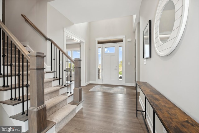 entrance foyer with dark hardwood / wood-style floors