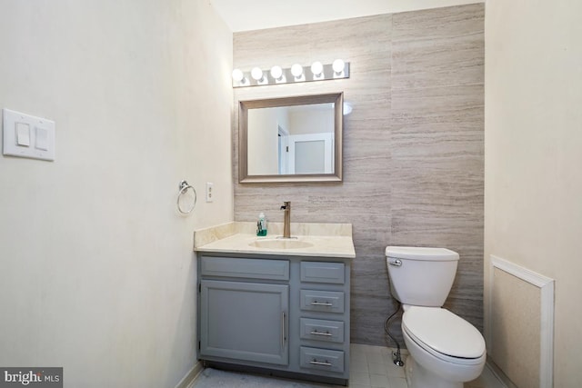 bathroom with toilet and vanity