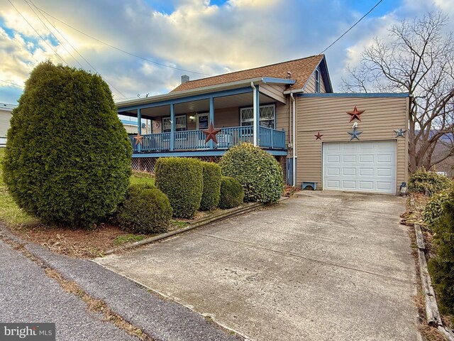 303 16th St, Saxton, PA 16678 - view of front of house with a porch and a garage