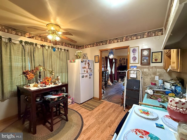 303 16th St, Saxton, PA 16678 - kitchen featuring ceiling fan, white fridge, and wood-type flooring