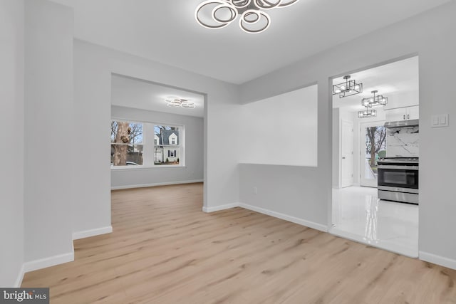 unfurnished dining area featuring light hardwood / wood-style flooring