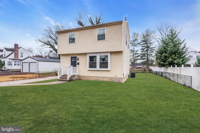 view of front of home featuring central AC unit and a front yard