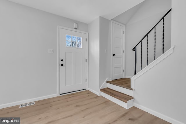 foyer entrance with light wood-type flooring