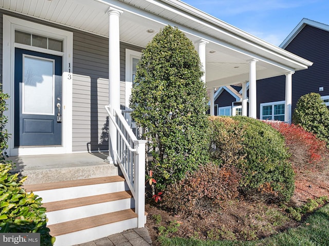 property entrance featuring covered porch