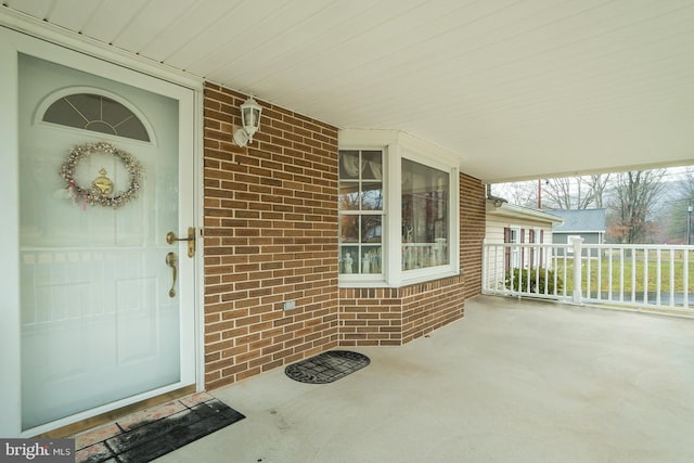 doorway to property with covered porch