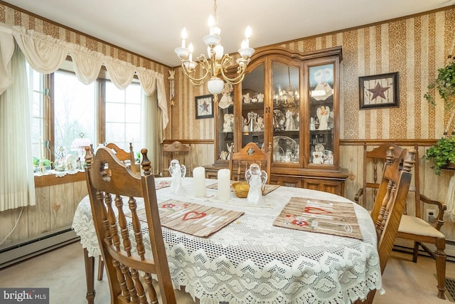 dining room featuring wood walls, a chandelier, and a baseboard radiator