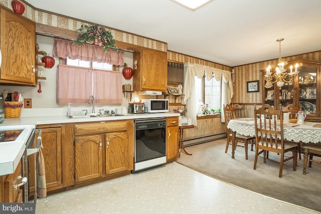 kitchen featuring a baseboard heating unit, sink, decorative light fixtures, dishwasher, and a chandelier