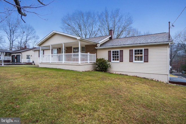 view of front of house featuring a front yard and a porch