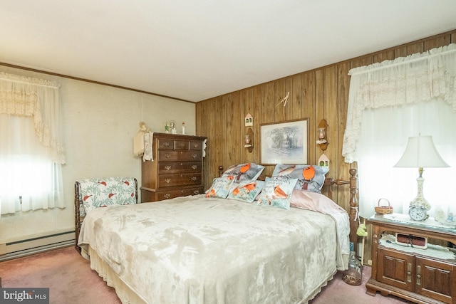 carpeted bedroom featuring baseboard heating and wood walls