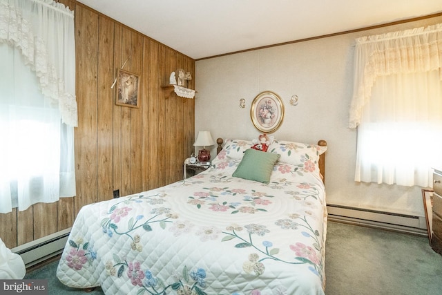 bedroom featuring multiple windows and baseboard heating