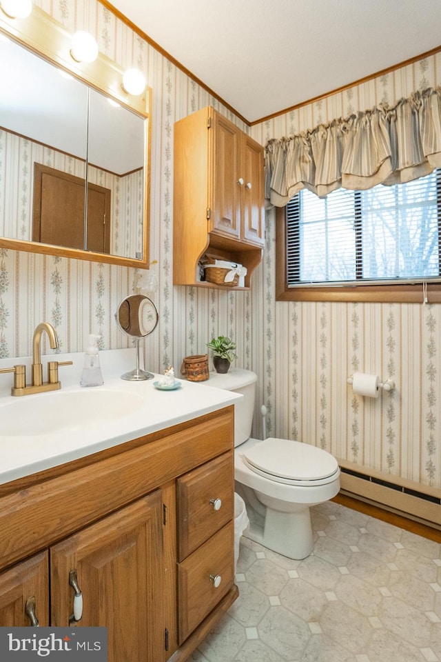 bathroom featuring vanity, a baseboard radiator, toilet, and ornamental molding