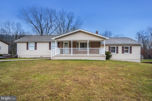 ranch-style house with covered porch and a front yard