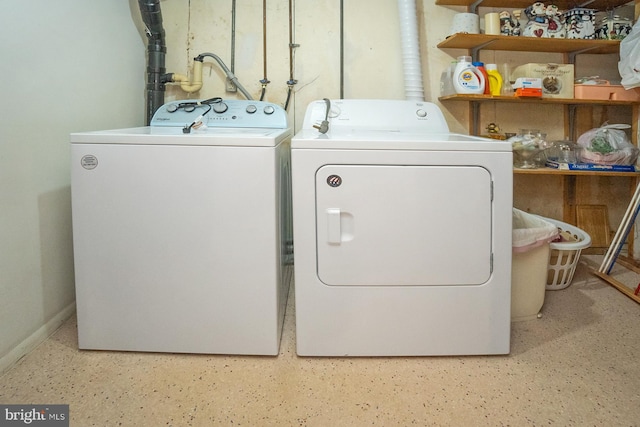 laundry area with washing machine and dryer